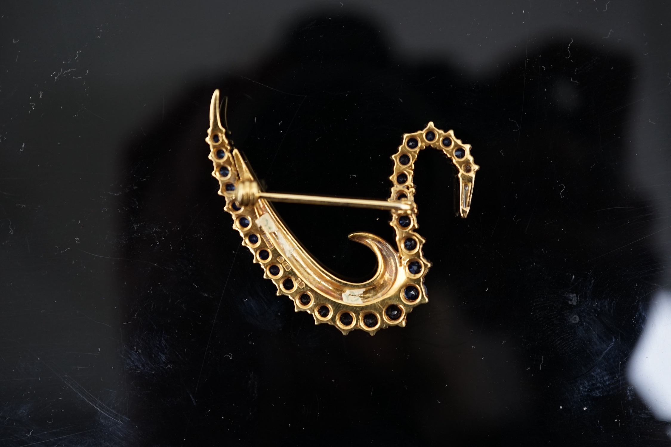A 1990's 18ct gold, sapphire and diamond cluster brooch, modelled as a swan